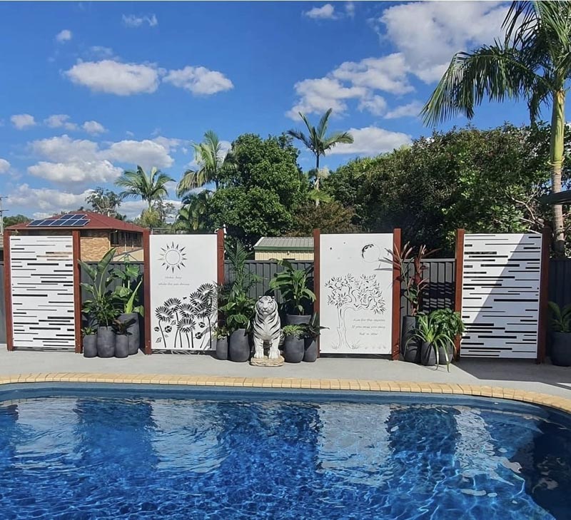 Decorative laser cut privacy screen installed in a Brisbane garden